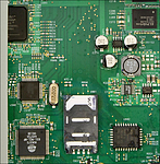 V detailu řadič paměťových karet Alcor Micro AU6375 a EPROM ST Microelectronics
